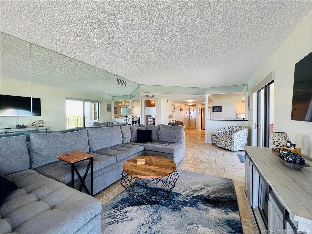 Undisclosed Address Jensen Beach, FL 34957 - Photo 29 of 86 a living room with furniture rug and a flat screen tv