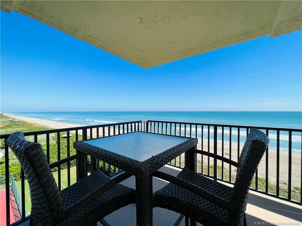 Undisclosed Address Jensen Beach, FL 34957 - Photo 42 of 86 a view of a balcony with a table and chairs