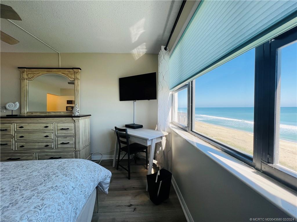 Undisclosed Address Jensen Beach, FL 34957 - Photo 49 of 86 a bedroom with a bed and a flat screen tv