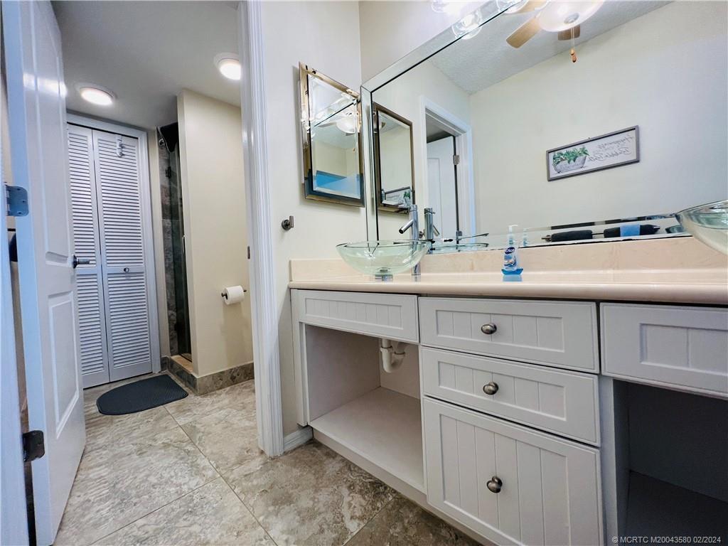 Undisclosed Address Jensen Beach, FL 34957 - Photo 52 of 86 a bathroom with a double vanity sink mirror and
