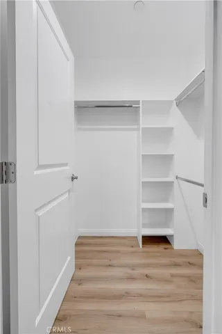 a bedroom with bed and window