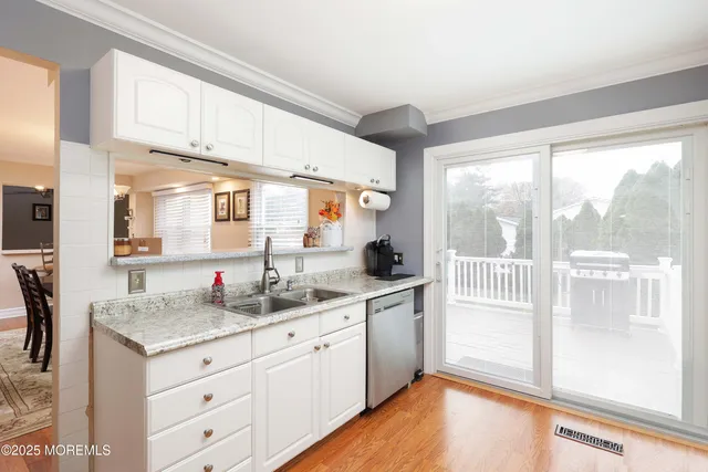 a kitchen with sink cabinets and outdoor view