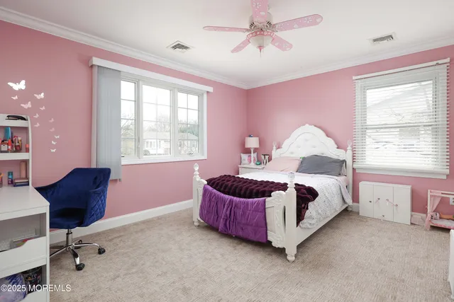a view of a livingroom with workspace and a window