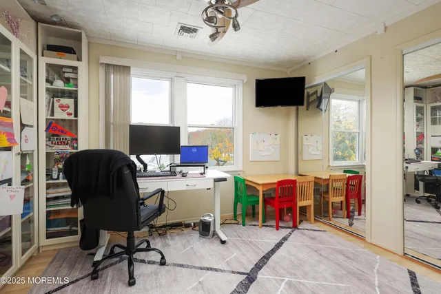 a bathroom with a sink toilet and window