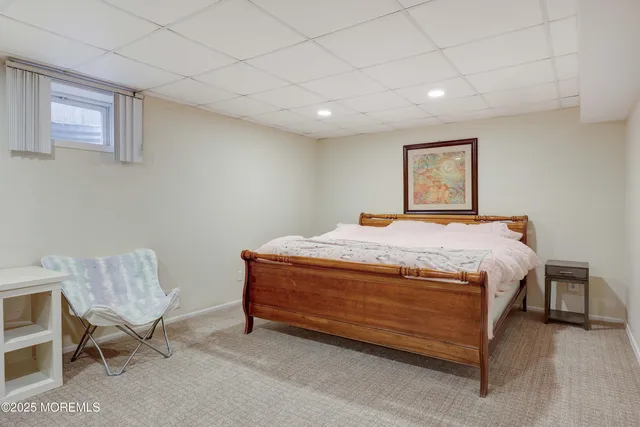 a bathroom with a sink a table and chairs