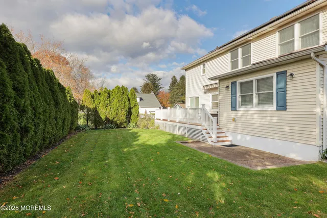 a backyard of a house with lots of green space