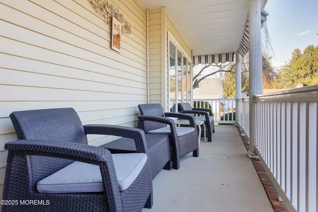 a view of balcony with chairs and outdoor seating