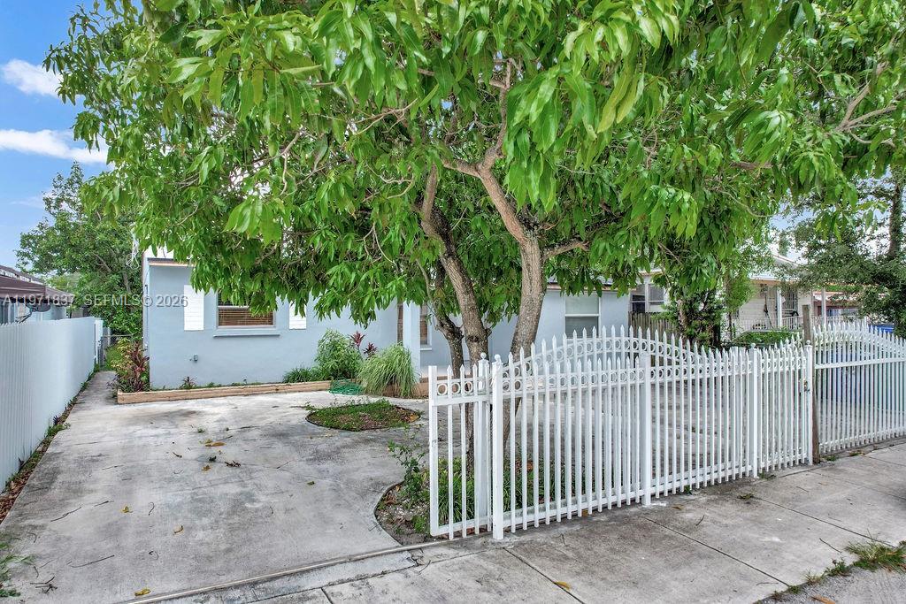 3010 Northwest 95th Terrace, Unit B Miami, FL 33147 - Photo 1 of 6 a view of a house with a small yard