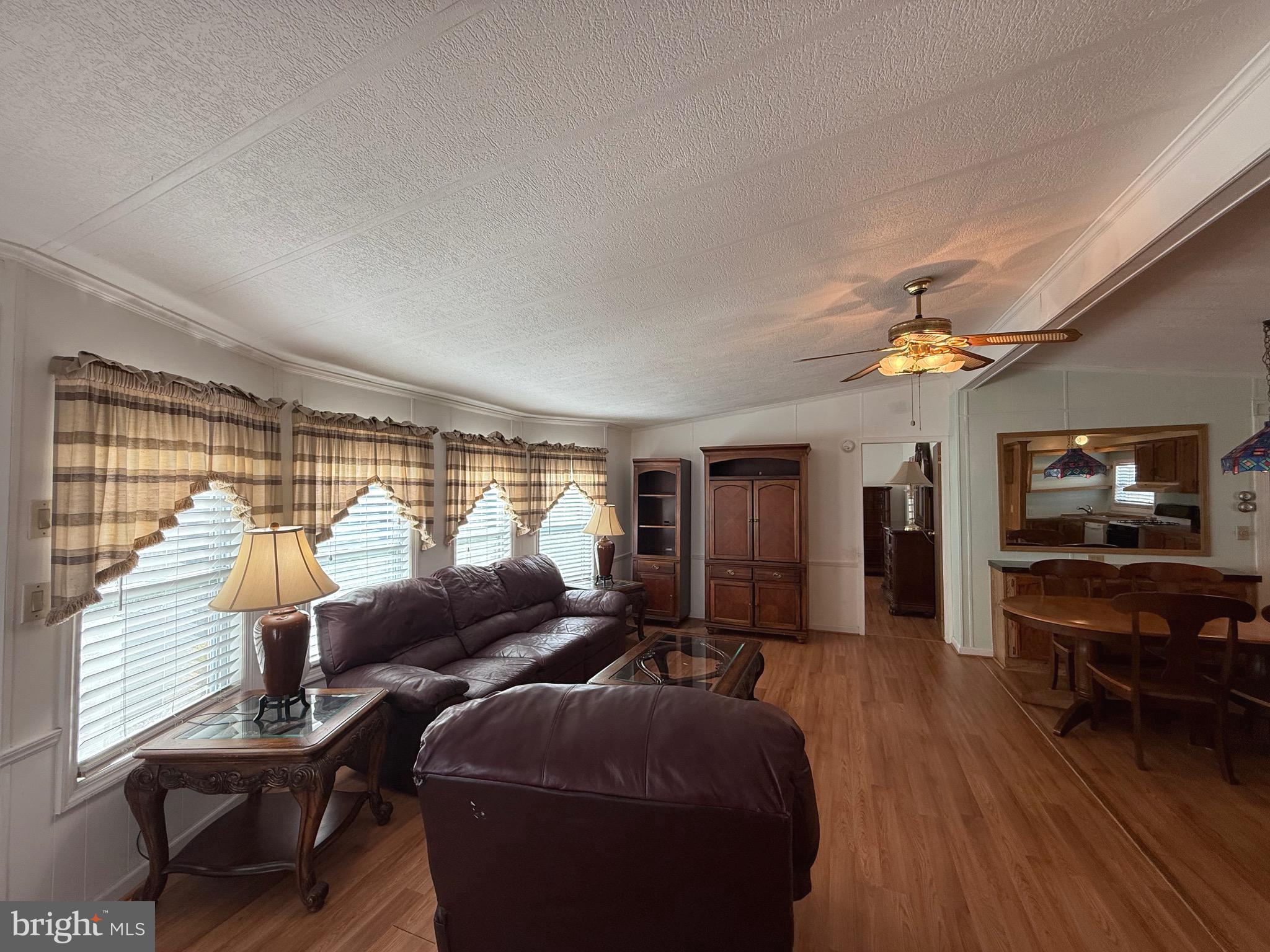 386 Indian Way Buena, NJ 08310 - Photo 13 of 53 a living room with furniture and a flat screen tv