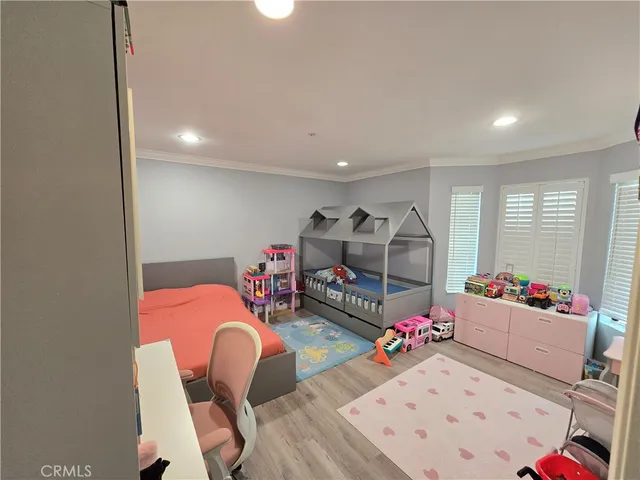 a living room with dining room and furniture