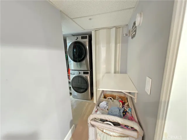 a bathroom with a granite countertop sink toilet and mirror