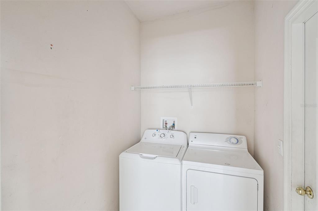 1755 Royal Ridge Drive Davenport, FL 33896 - Photo 15 of 25 a utility room with dryer and washer