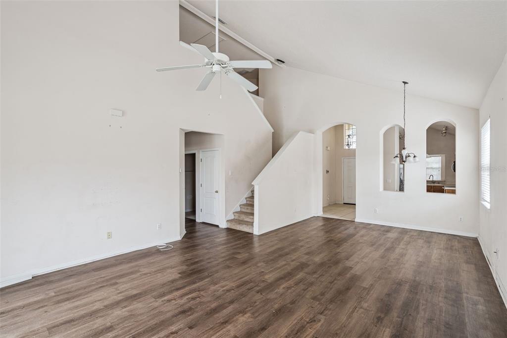 1755 Royal Ridge Drive Davenport, FL 33896 - Photo 2 of 25 a view of a room with wooden floor