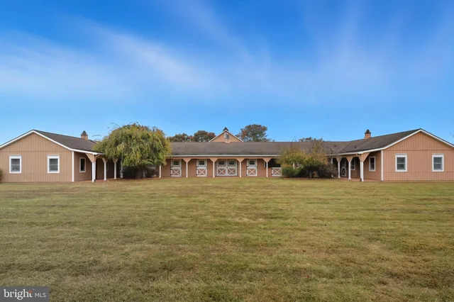 a kitchen with stainless steel appliances granite countertop a sink a stove and cabinets