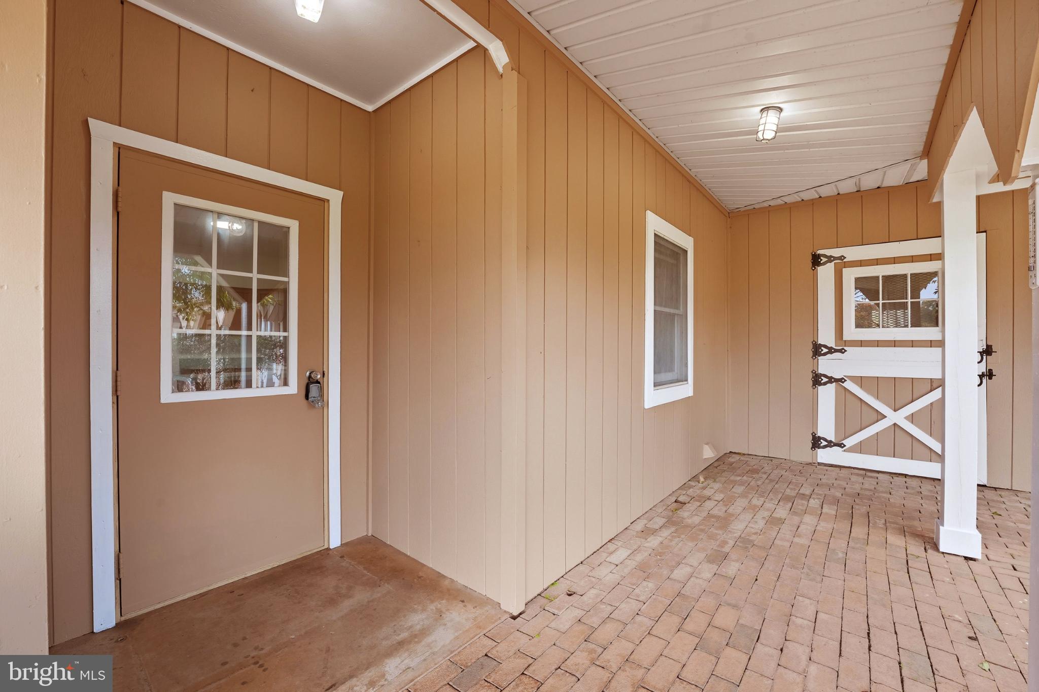8021 Olympic Way Culpeper, VA 22701 - Photo 33 of 78 a view of an empty room with wooden floor and a window