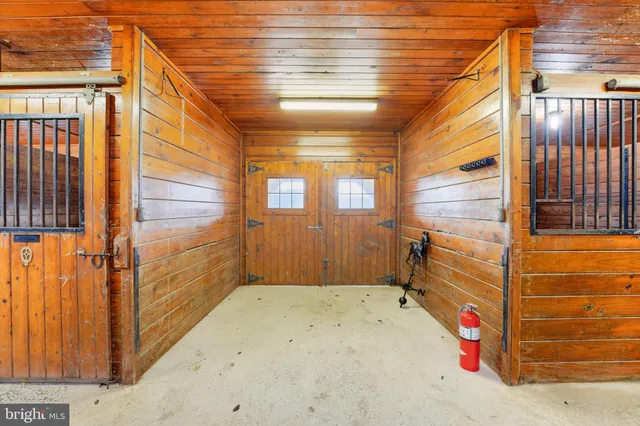 an empty room with wooden floor and a window