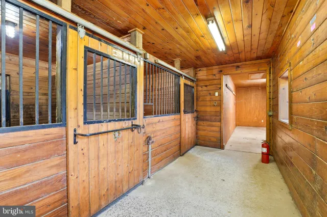 a view of an empty room with staircase