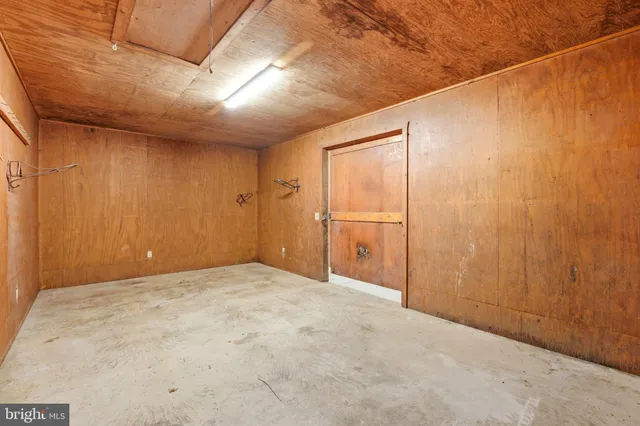a view of an empty room with a staircase