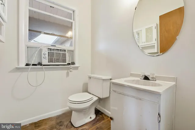 a kitchen with granite countertop white cabinets stainless steel appliances a sink and dishwasher