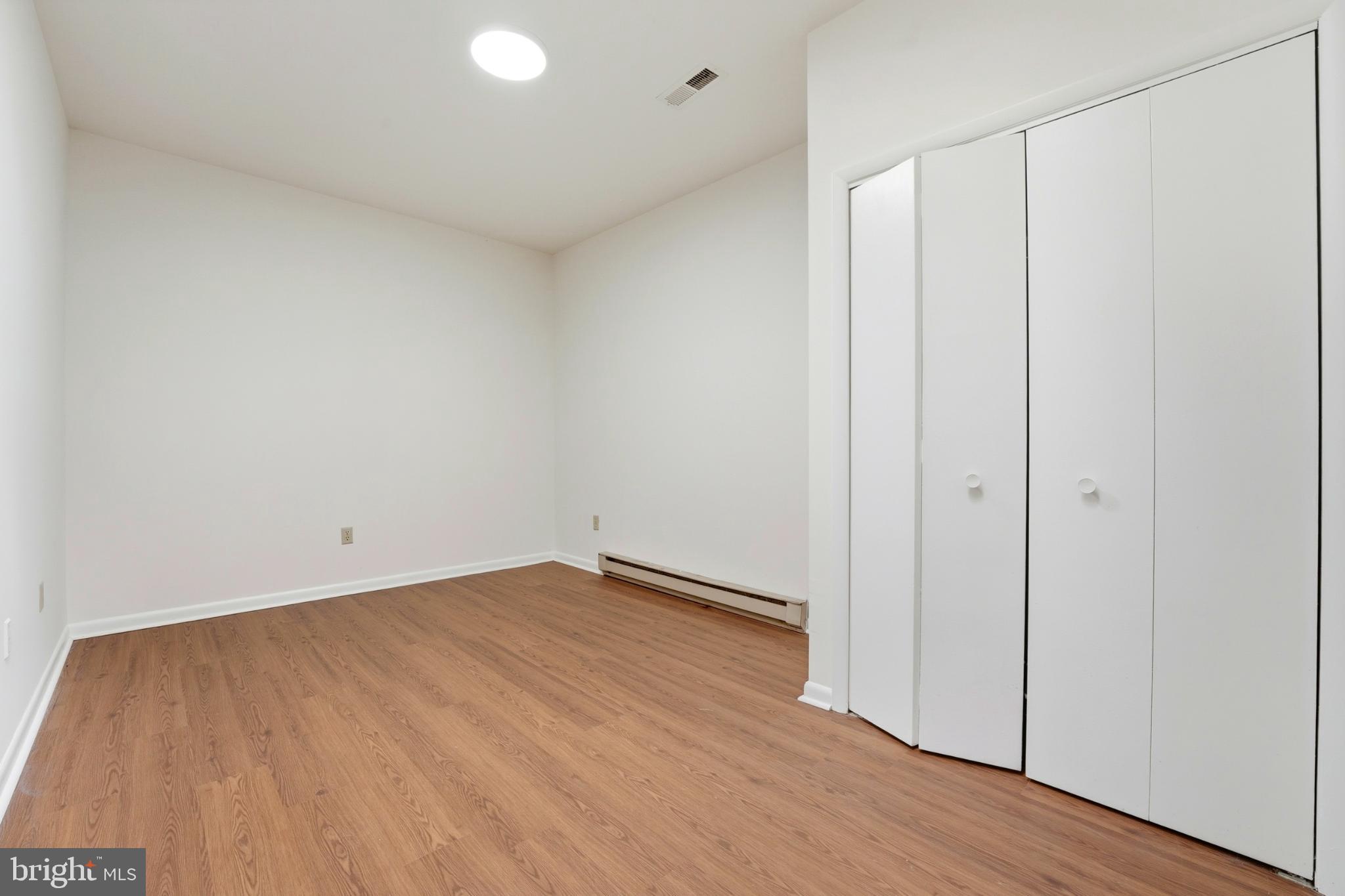 8021 Olympic Way Culpeper, VA 22701 - Photo 59 of 78 a view of an empty room with wooden floor