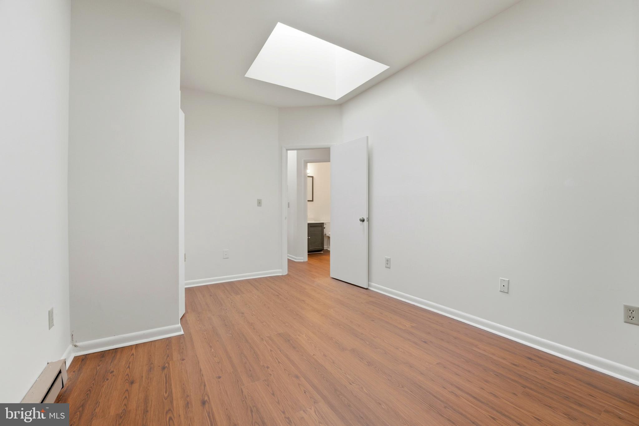 8021 Olympic Way Culpeper, VA 22701 - Photo 60 of 78 an empty room with wooden floor and a window