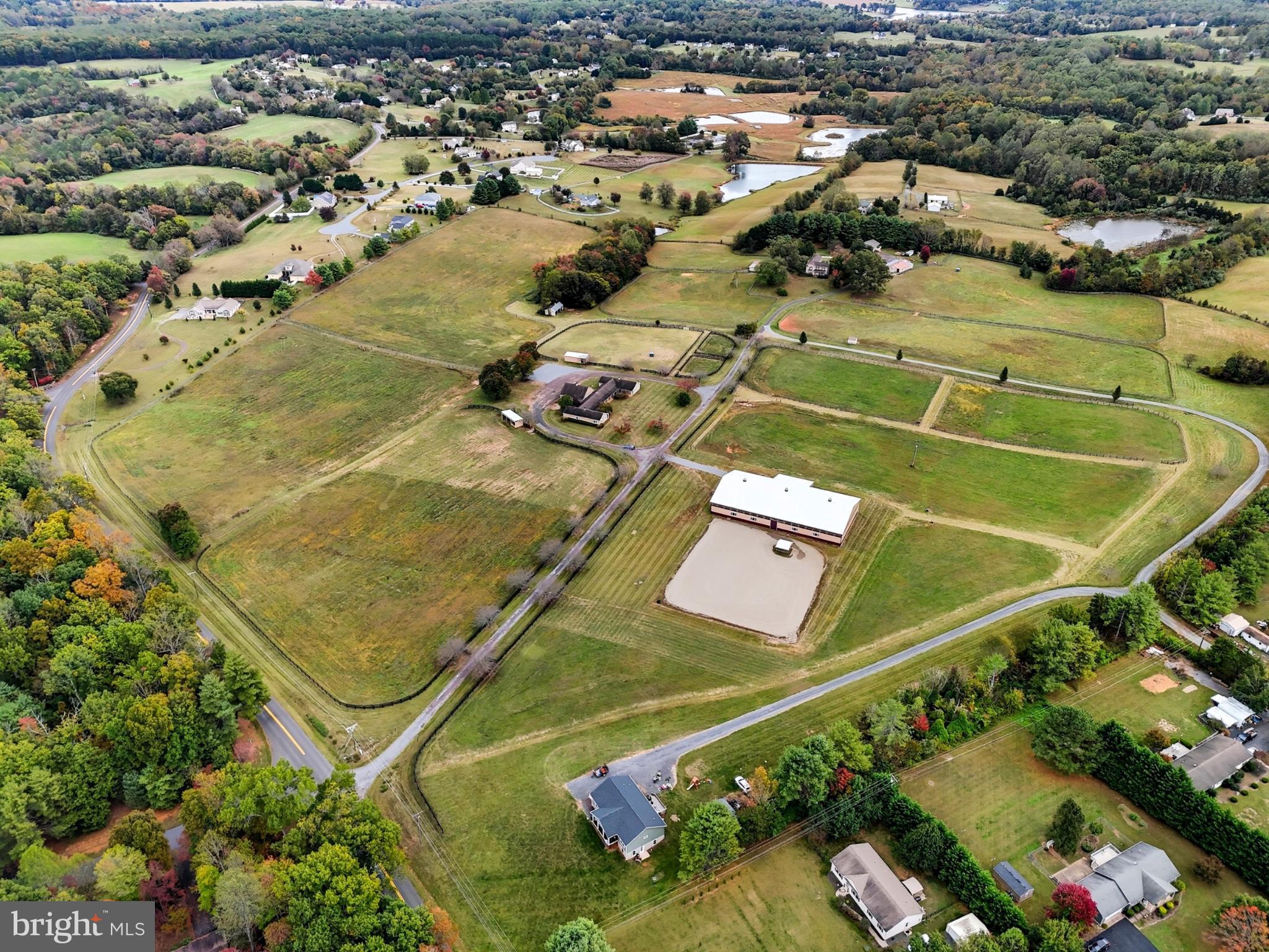 8021 Olympic Way Culpeper, VA 22701 - Photo 6 of 78 an aerial view of a tennis ground and a cars park side of the road