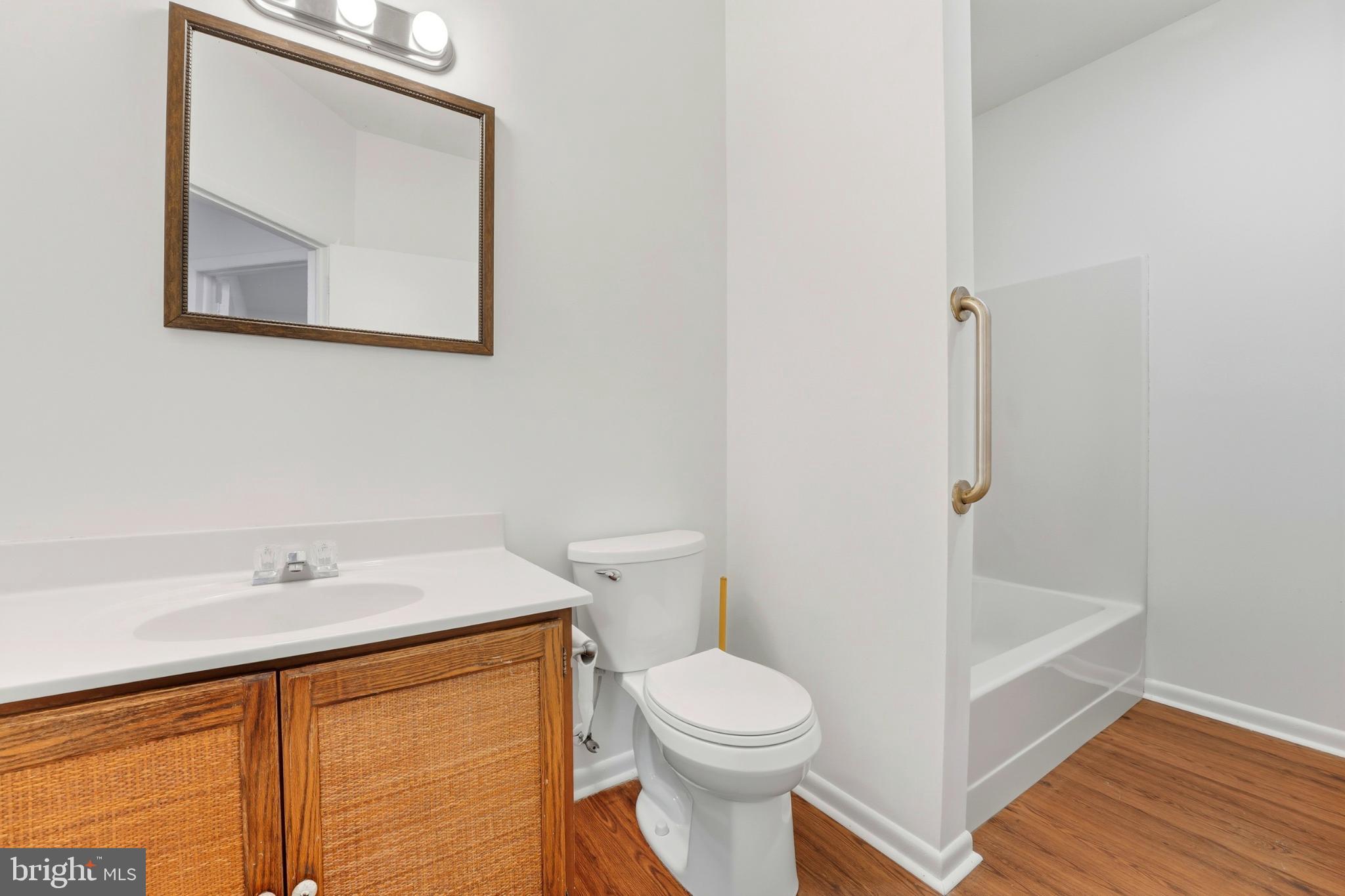 8021 Olympic Way Culpeper, VA 22701 - Photo 61 of 78 a white toilet sitting next to a bathroom sink