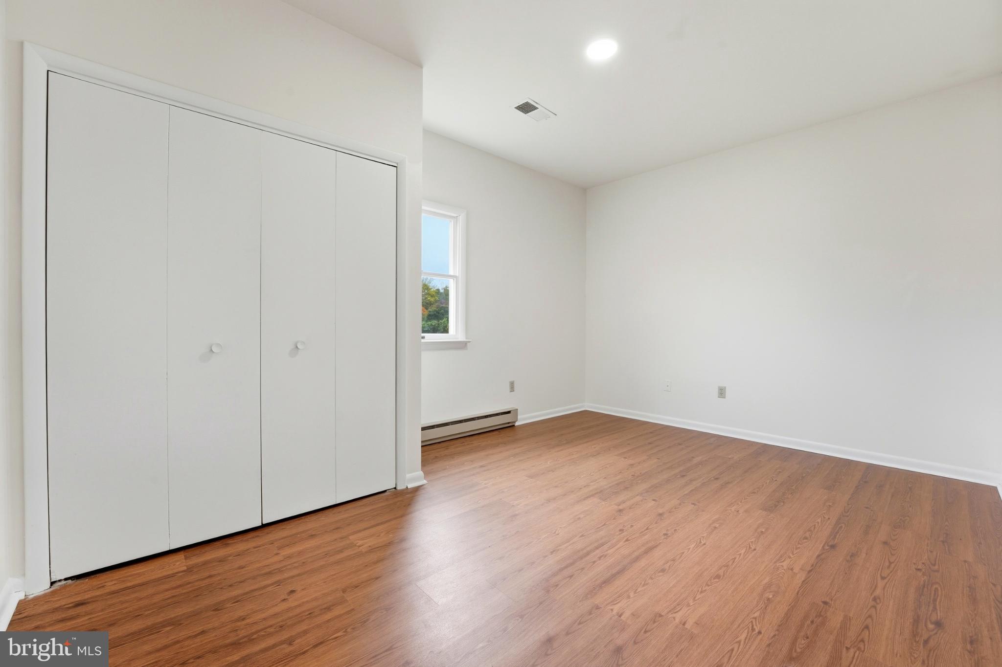 8021 Olympic Way Culpeper, VA 22701 - Photo 62 of 78 a view of an empty room with wooden floor