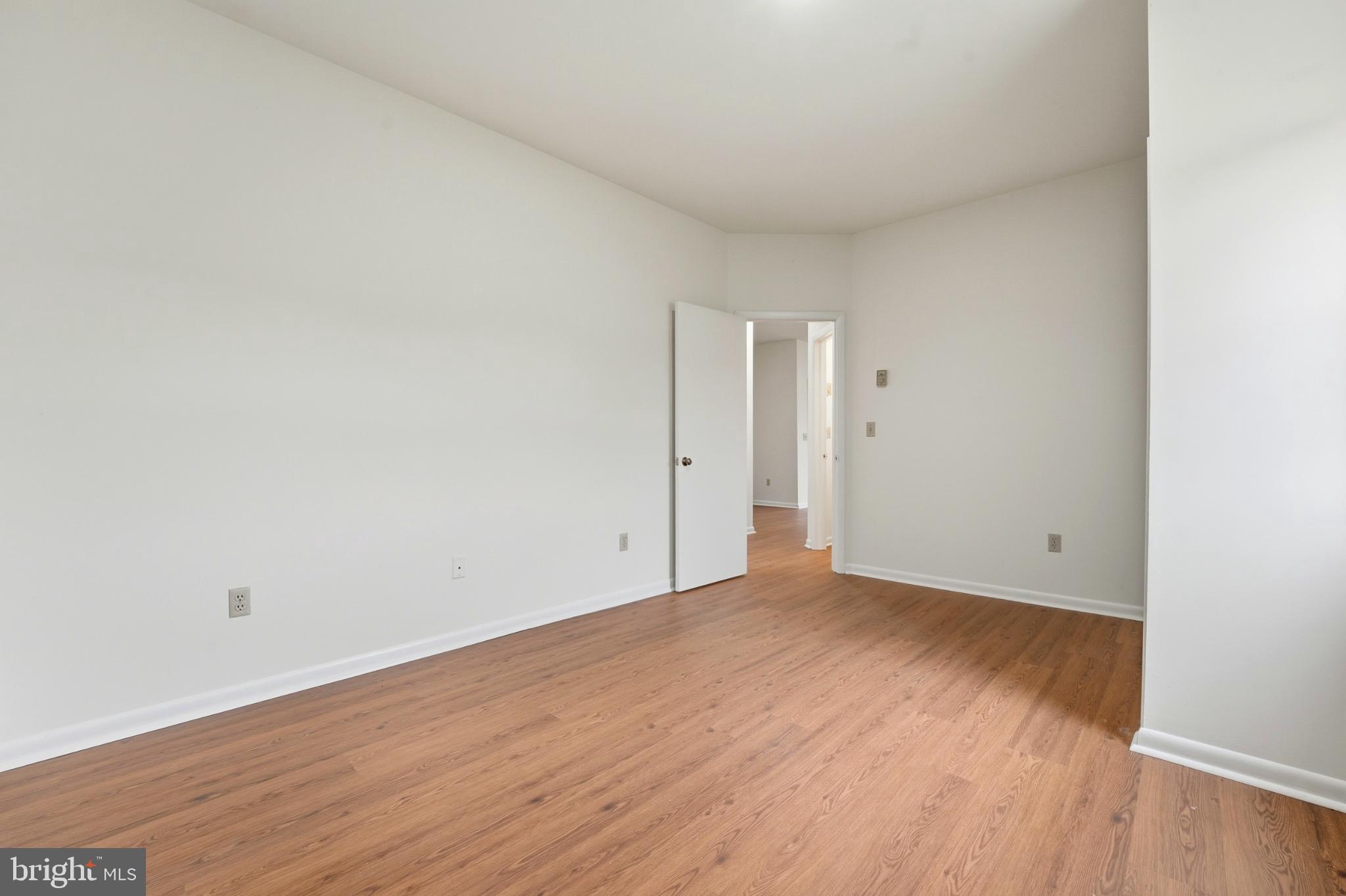 8021 Olympic Way Culpeper, VA 22701 - Photo 63 of 78 a view of an empty room and wooden floor