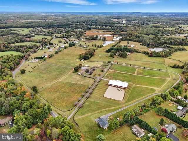 an aerial view of a pool table and chairs