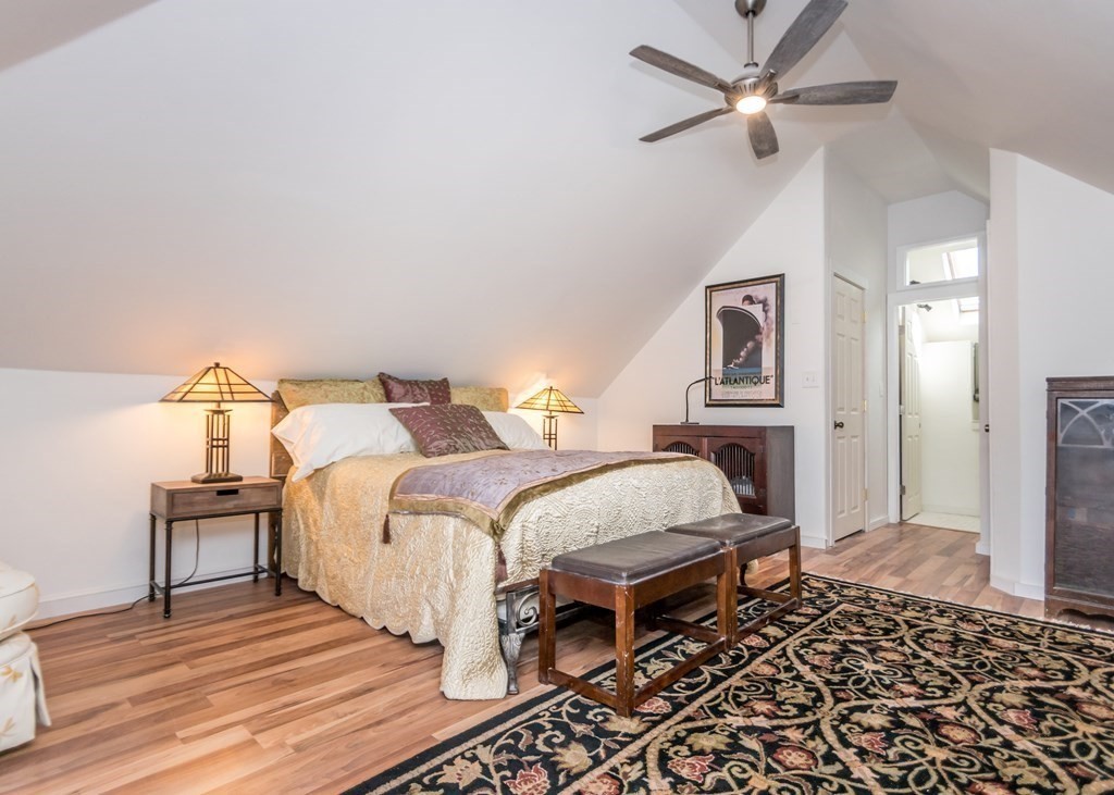 16 Hamblin Road, Unit 2 Waltham, MA 02453 - Photo 16 of 29 a bedroom with a bed and wooden floor