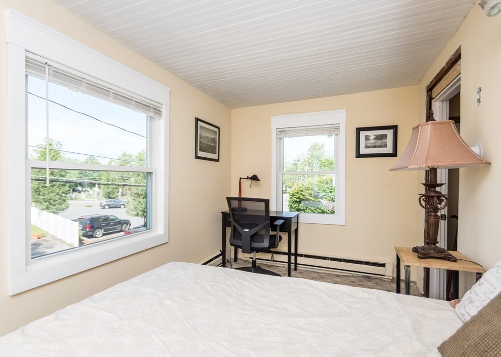16 Hamblin Road, Unit 2 Waltham, MA 02453 - Photo 19 of 29 a living room with furniture and a window