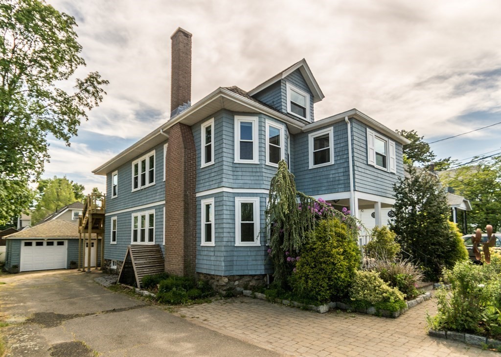 16 Hamblin Road, Unit 2 Waltham, MA 02453 - Photo 2 of 29 a front view of a house with garden