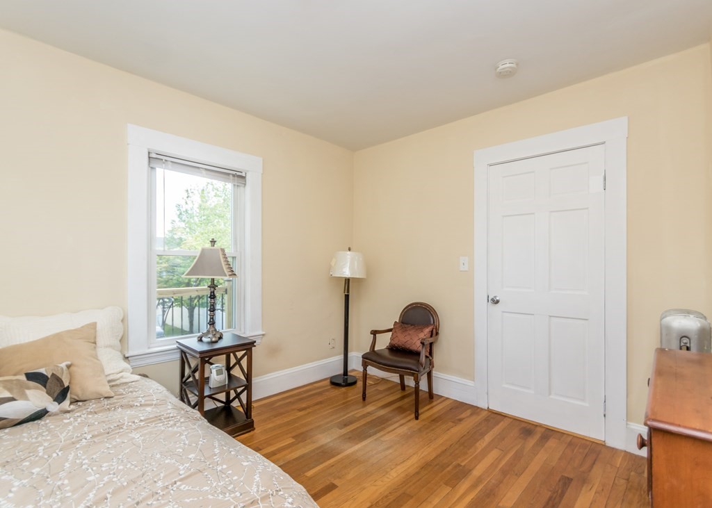 16 Hamblin Road, Unit 2 Waltham, MA 02453 - Photo 21 of 29 a bedroom with a bed and a window