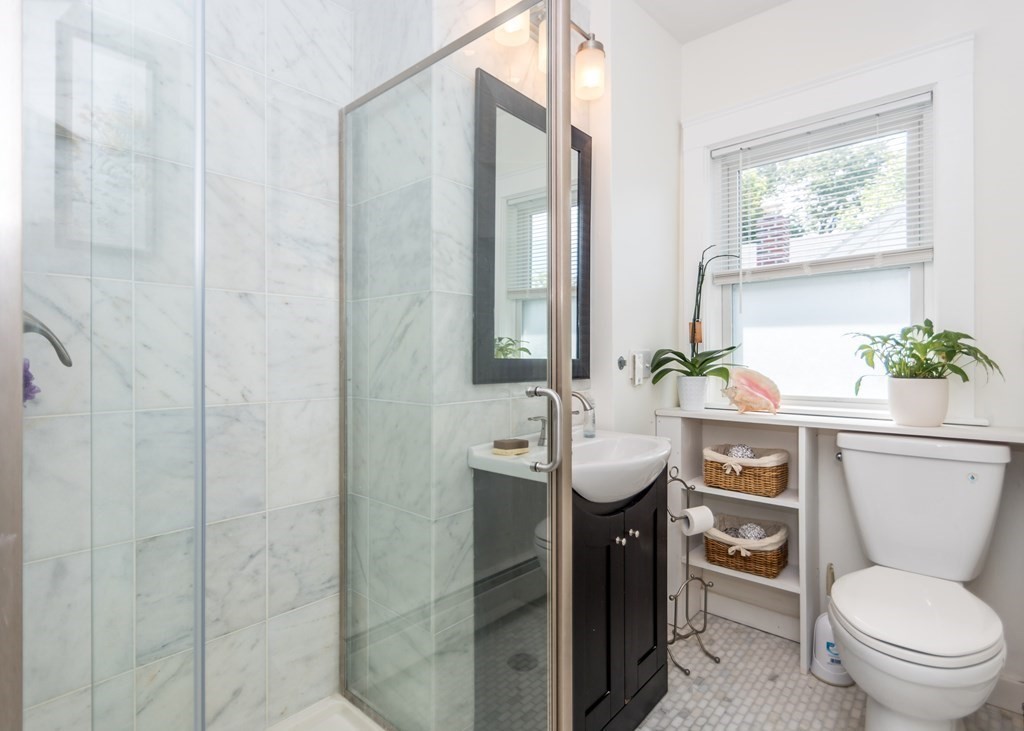 16 Hamblin Road, Unit 2 Waltham, MA 02453 - Photo 22 of 29 a bathroom with a toilet sink and mirror