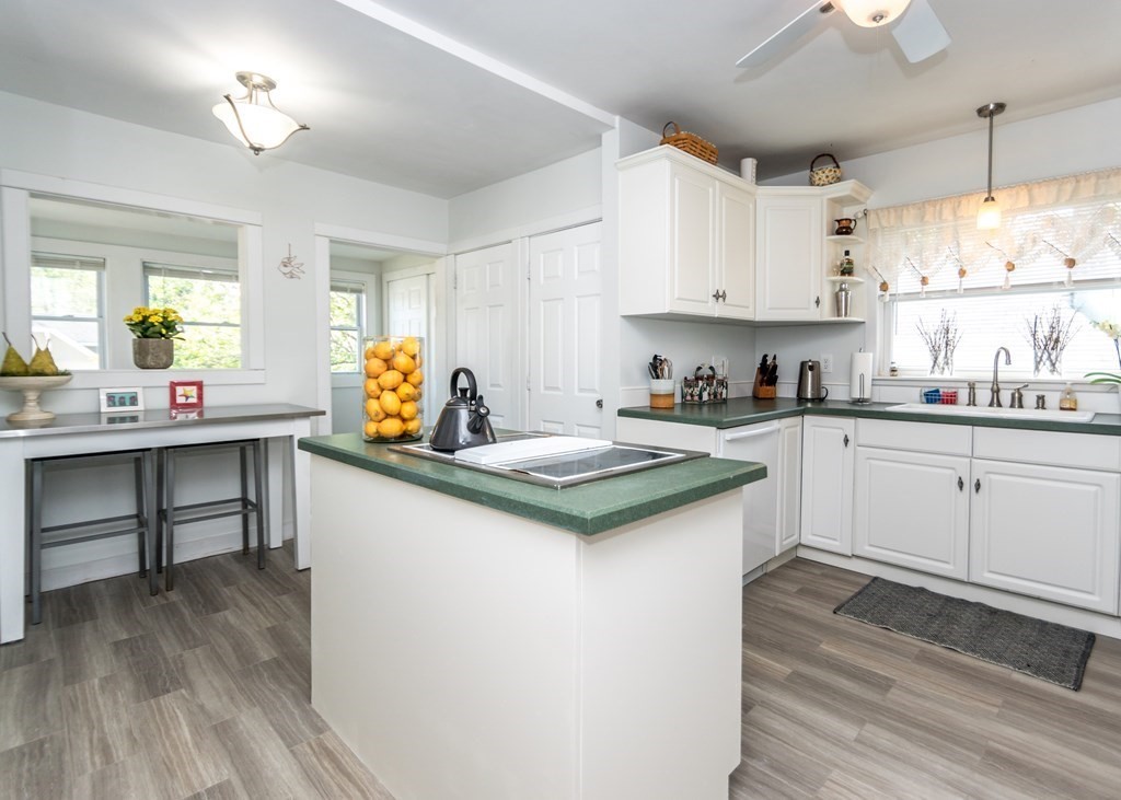 16 Hamblin Road, Unit 2 Waltham, MA 02453 - Photo 3 of 29 a kitchen with a sink stove and cabinets