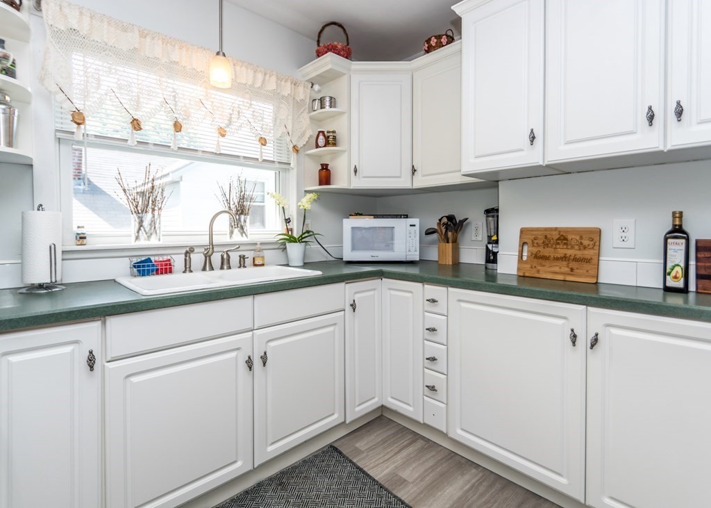 16 Hamblin Road, Unit 2 Waltham, MA 02453 - Photo 4 of 29 a kitchen with cabinets appliances and a sink