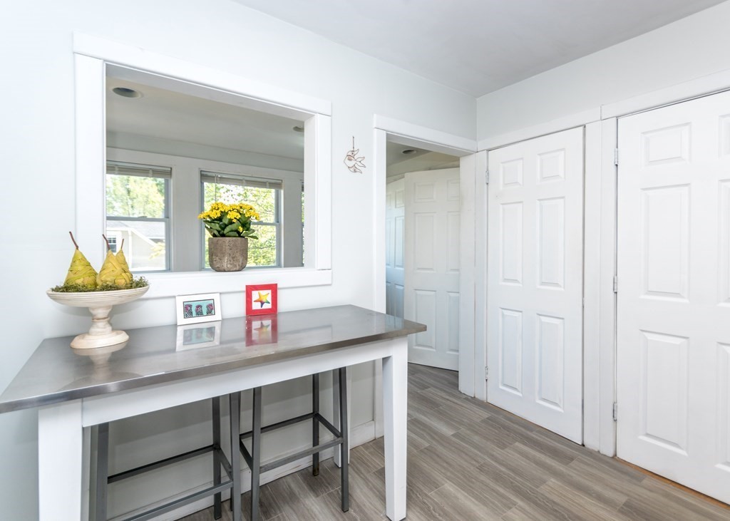 16 Hamblin Road, Unit 2 Waltham, MA 02453 - Photo 7 of 29 a kitchen with a sink cabinets and wooden floor