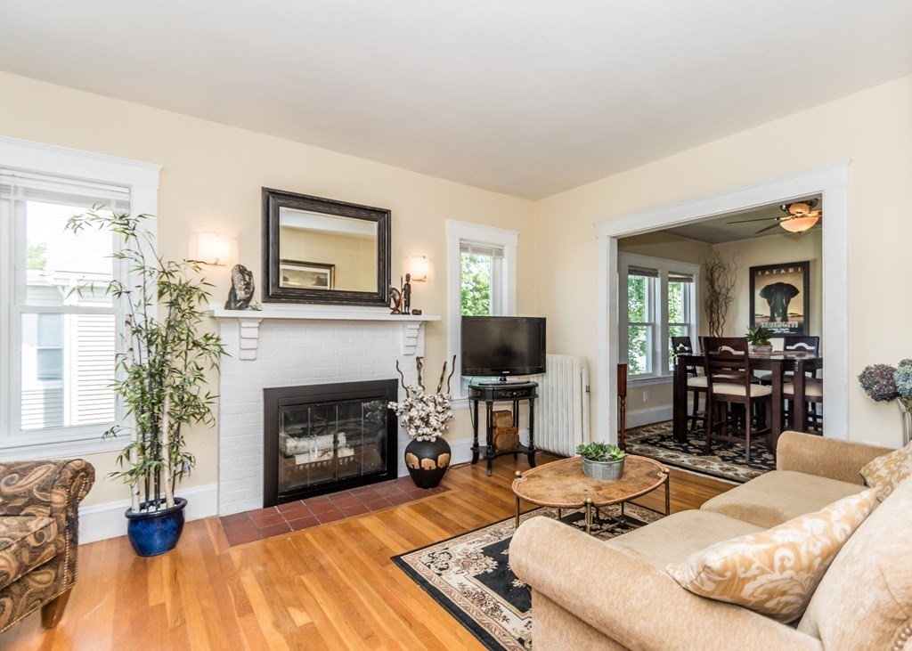 16 Hamblin Road, Unit 2 Waltham, MA 02453 - Photo 8 of 29 a living room with furniture and a fireplace