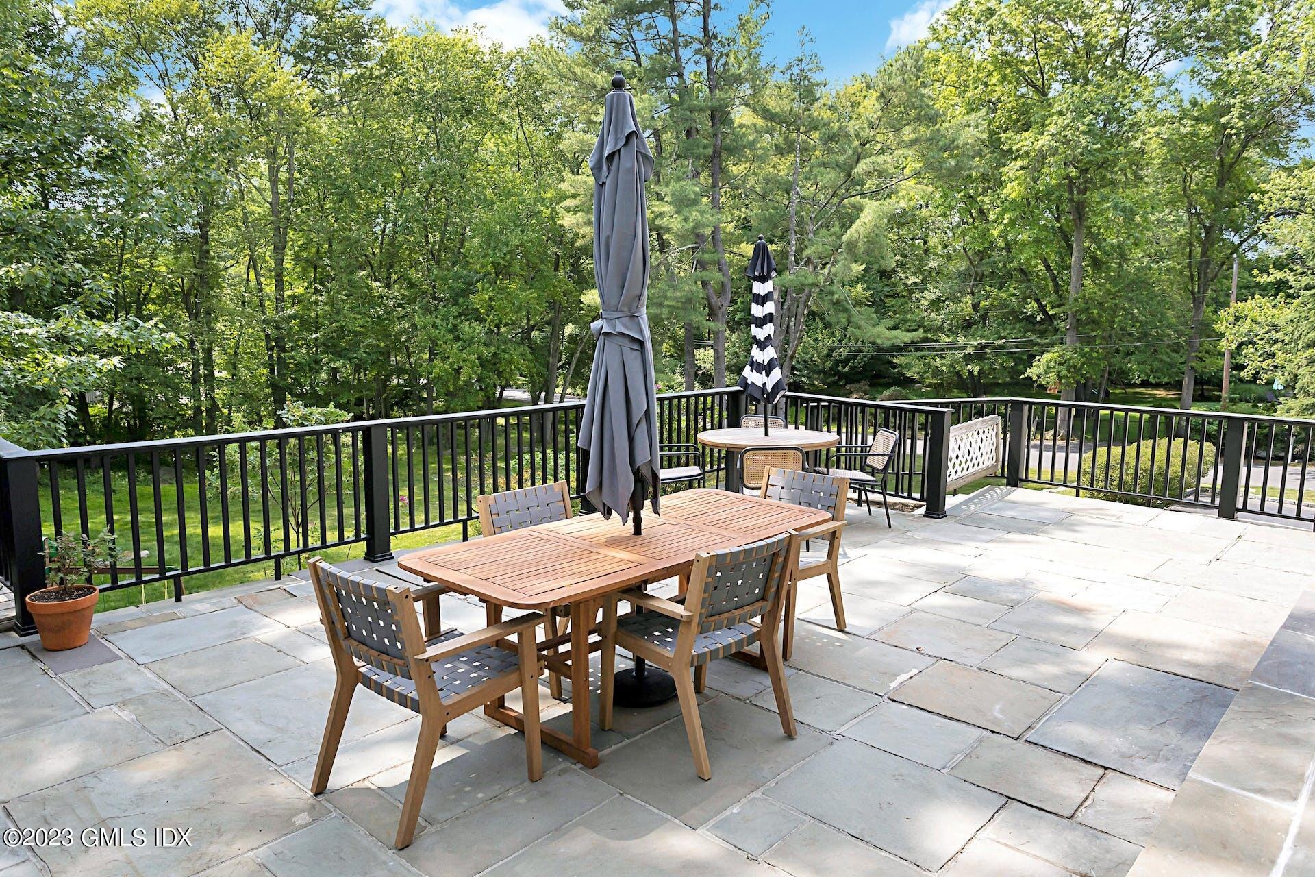 396 Westover Road Stamford, CT 06902 - Photo 32 of 39 a view of a dinning table and chairs on the roof deck