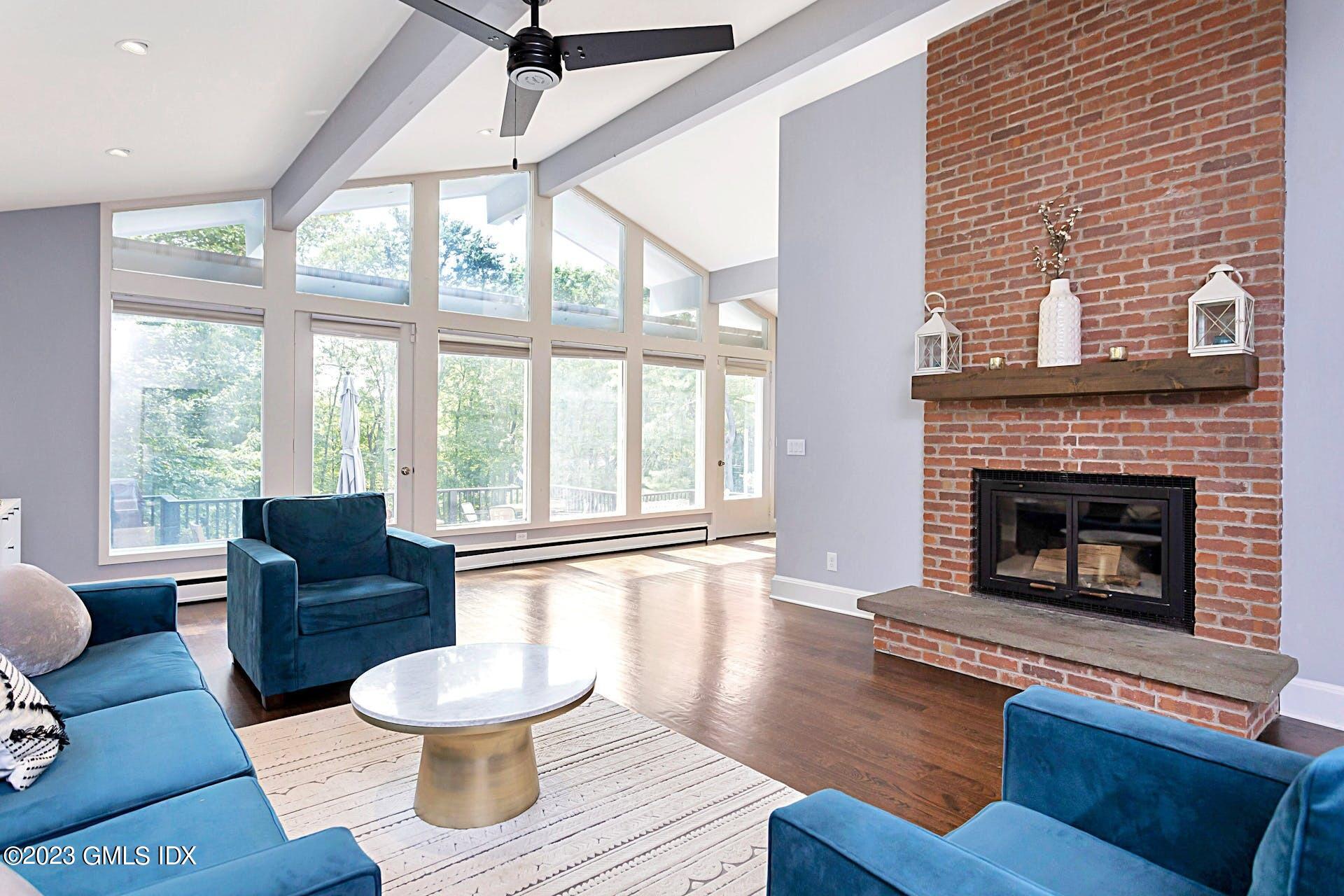 396 Westover Road Stamford, CT 06902 - Photo 8 of 39 a living room with furniture and a fireplace