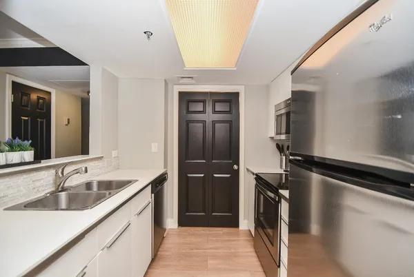 a kitchen with a sink and a window