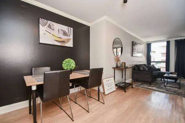 a living room with furniture and a rug