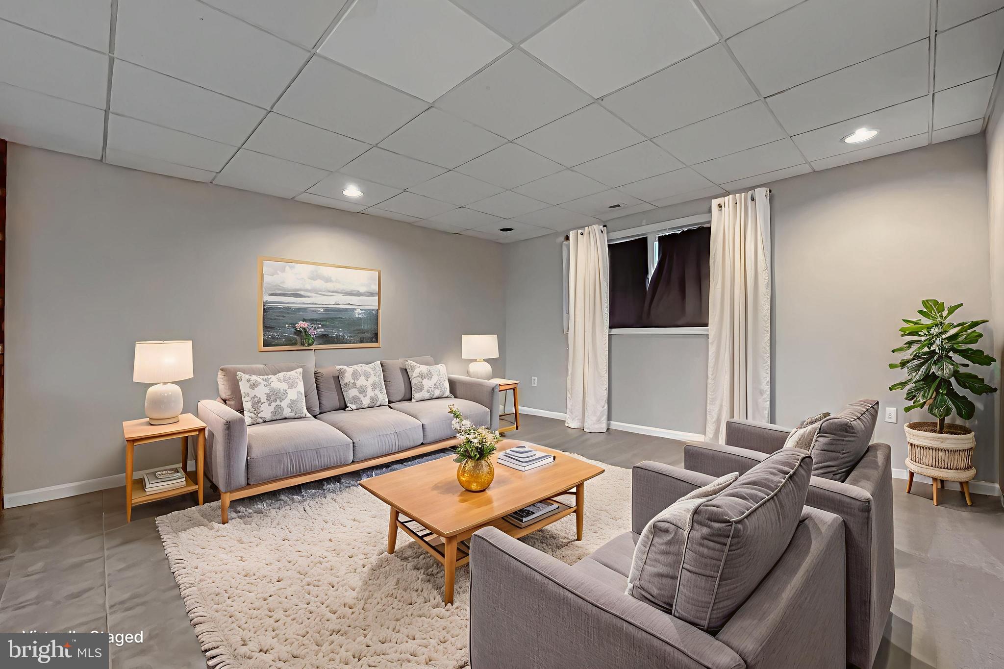 11106 Rawhide Road Lusby, MD 20657 - Photo 34 of 40 Virtually Staged Lower Level Family Room