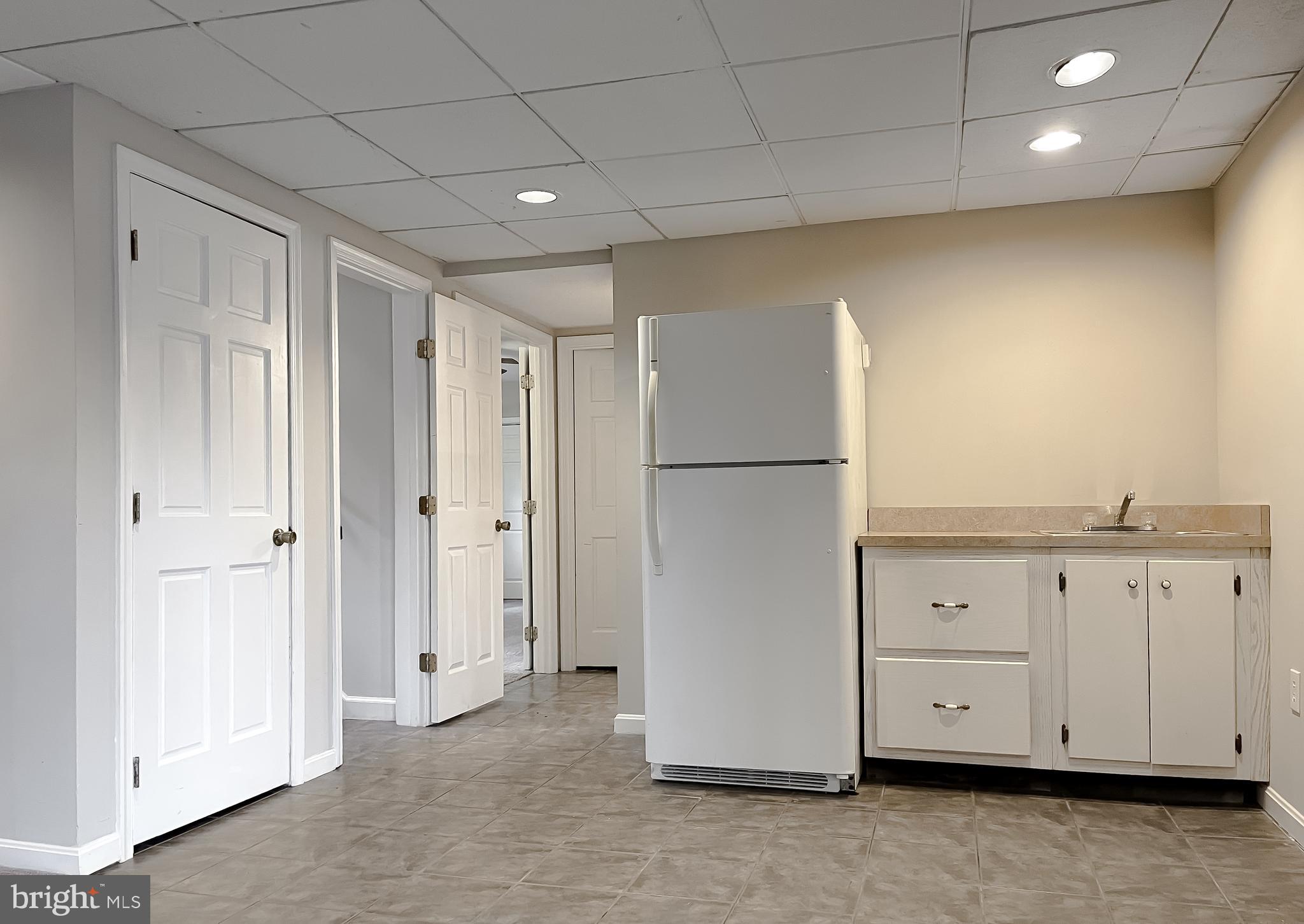 11106 Rawhide Road Lusby, MD 20657 - Photo 37 of 40 Lower Level Kitchenette