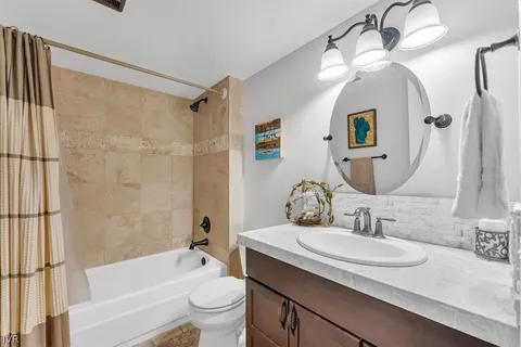 a view of a hallway with washer and dryer