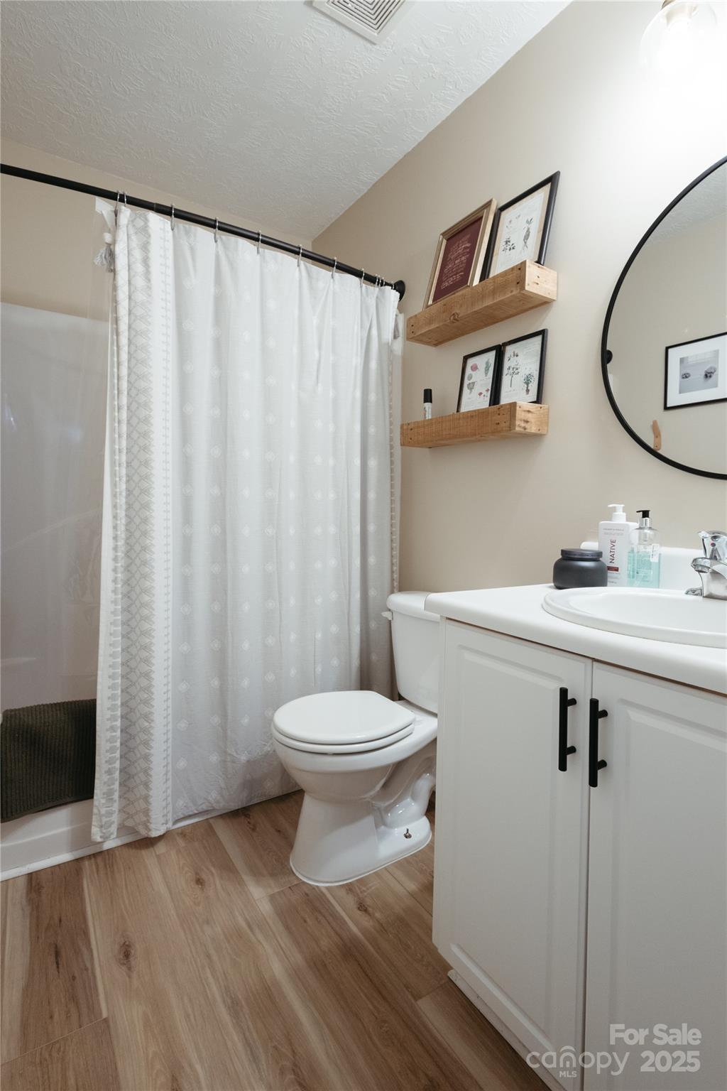 68 Lorry Court North Augusta, SC 29841 - Photo 10 of 16 a bathroom with a toilet a sink and a mirror