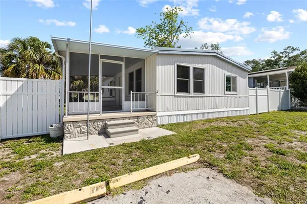 a view of a backyard of the house