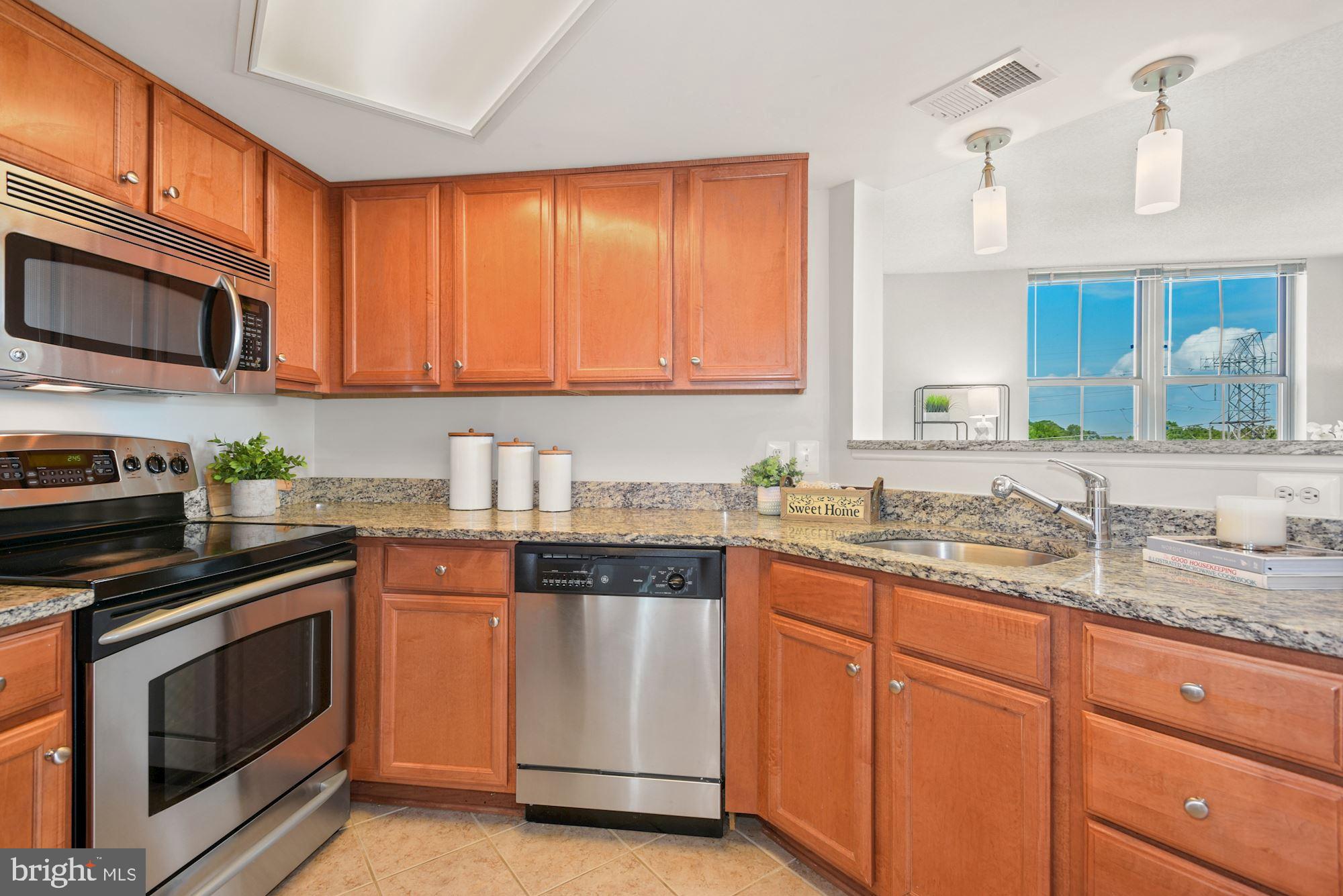 11800 Sunset Hills Road, Unit 622 Reston, VA 20190 - Photo 17 of 50 Kitchen with granite and stainless appliances