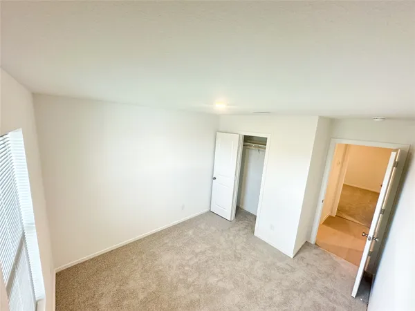 an empty room with a mirror